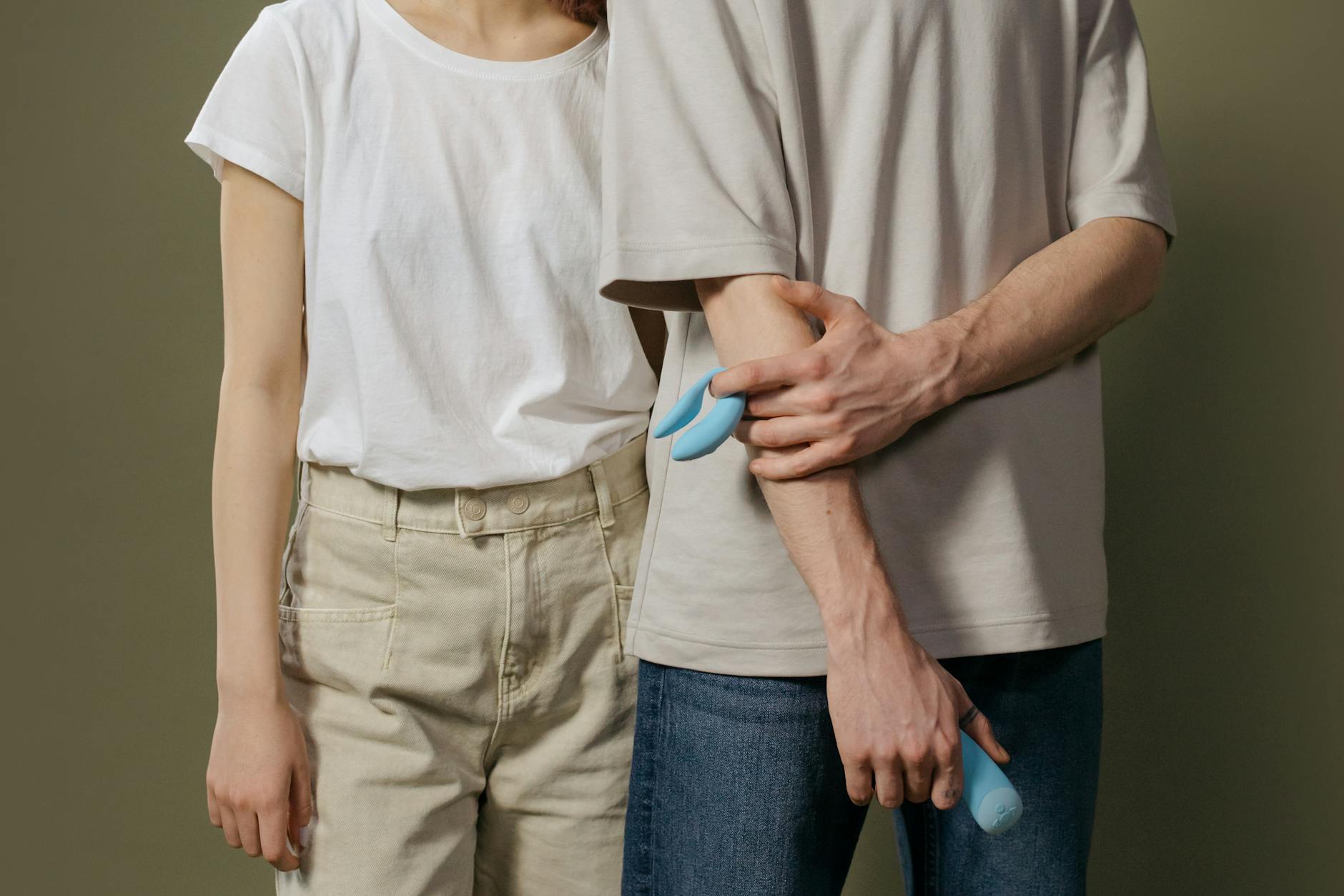 A blue silicone vibrator held in hand against a purple background, symbolizing self-care and reclaiming pleasure